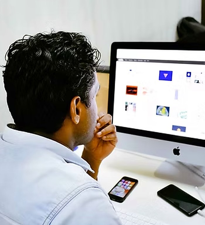 Professional managing his schedule on a computer