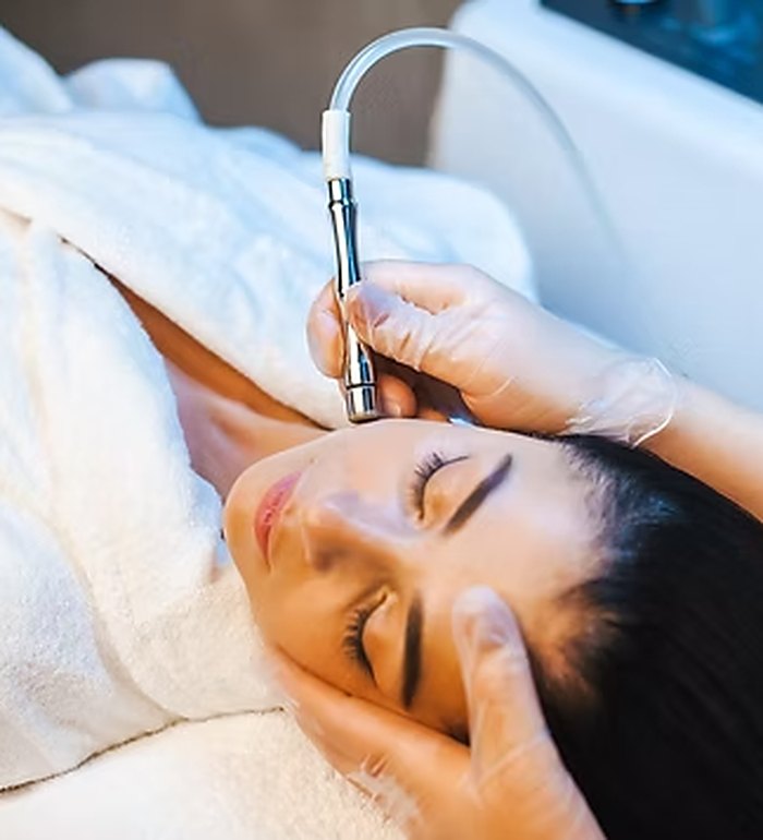 Esthetician using a professional treatment device